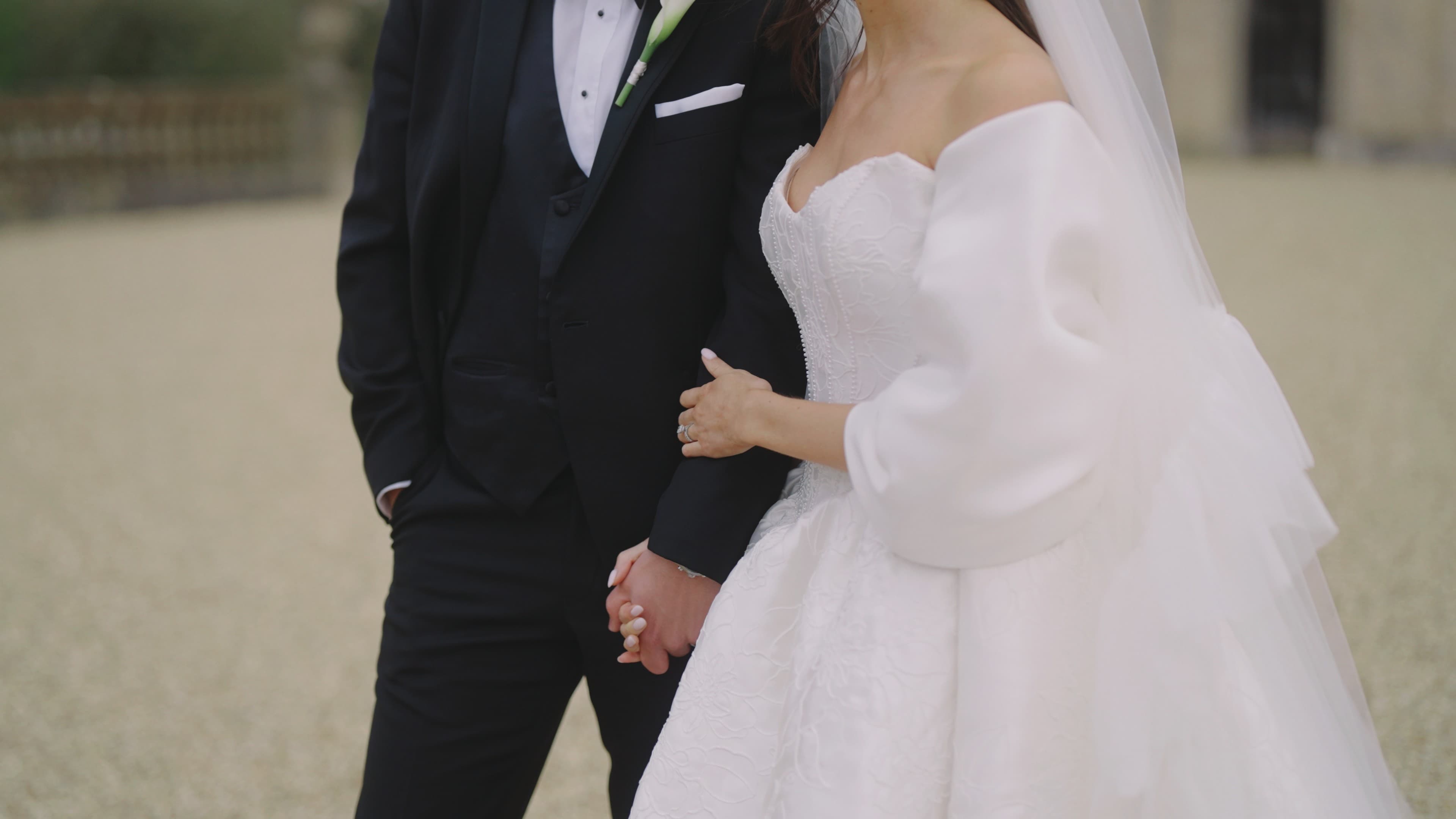 Bride and groom portrait in a sunlit field
